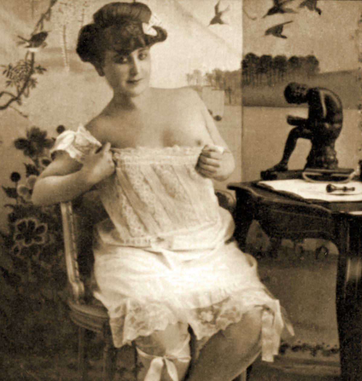 Young woman displaying a lacy chemise, c.1900 by Unknown
