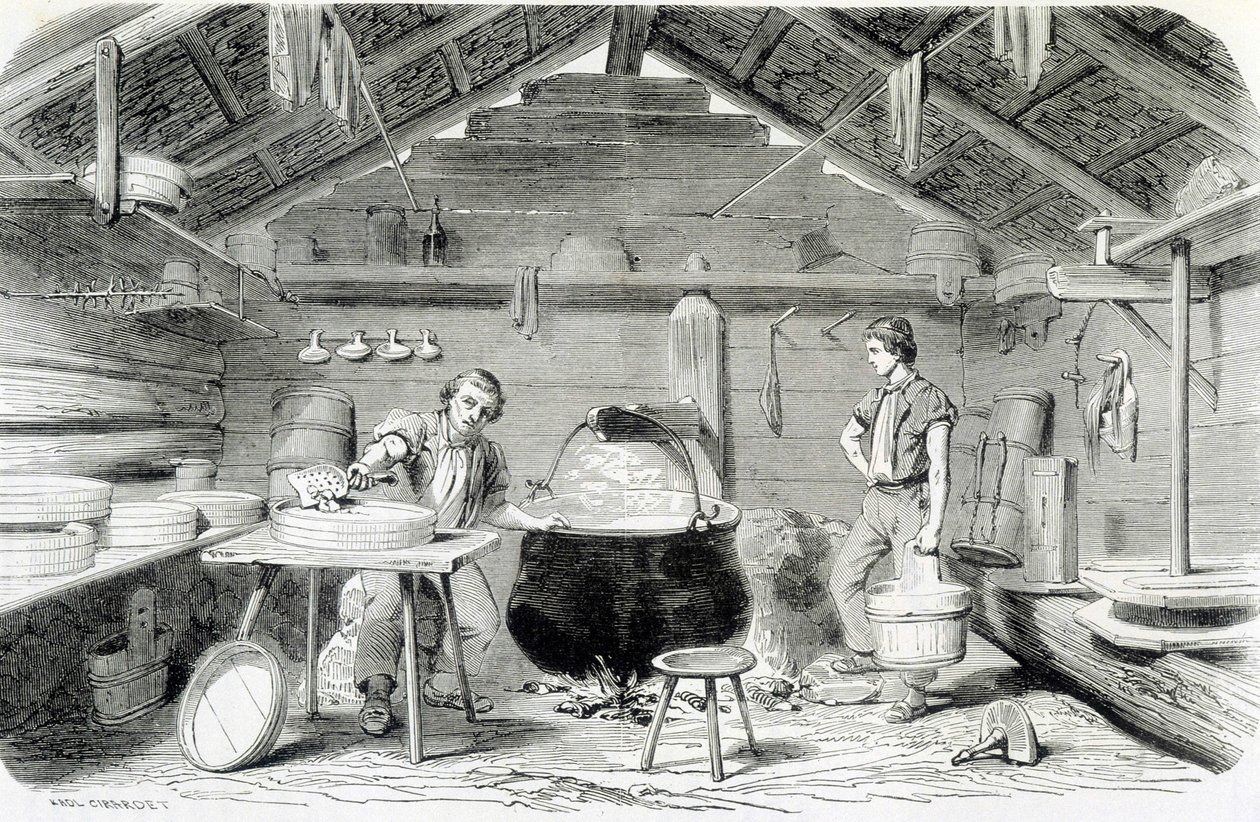 Making Gruyère cheese in a Swiss chalet, or cheese factory in the Alps - in 