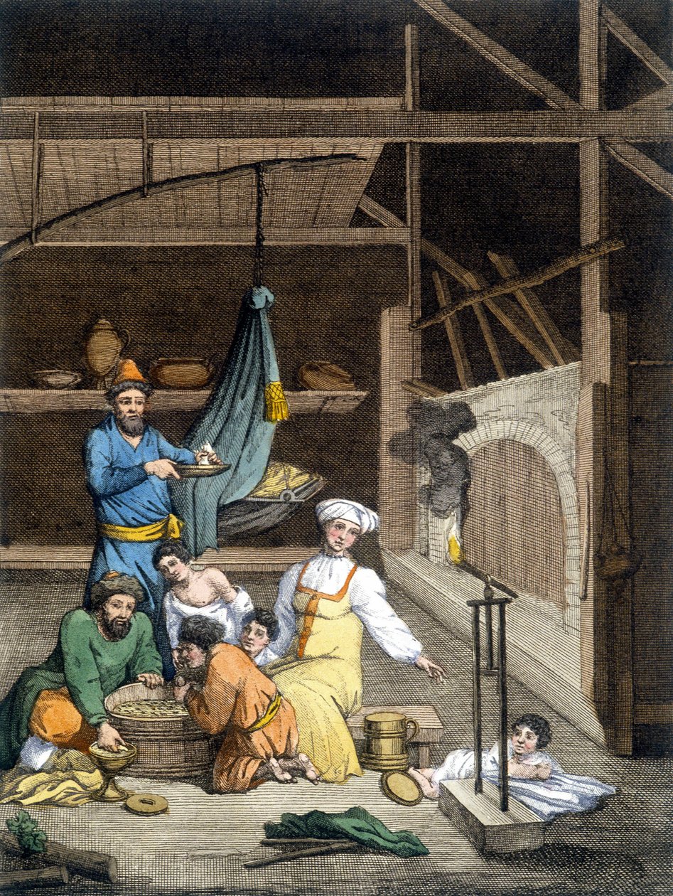 Inside a Russian house, a family at lunch time by Unknown artist