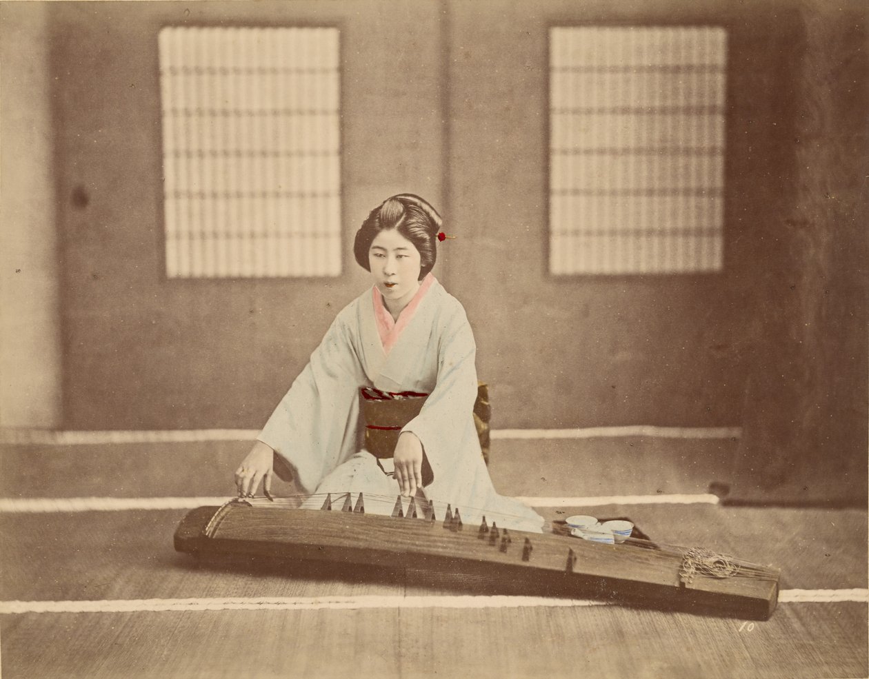 Japanese Woman Playing a Koto by Unknown artist