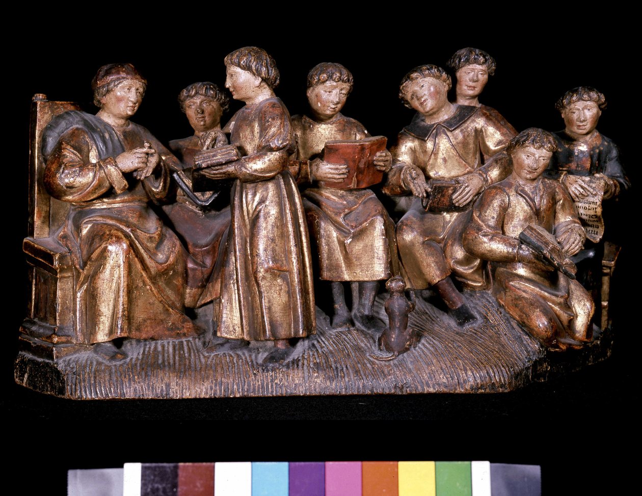Teacher and students - carved wood by Unknown artist