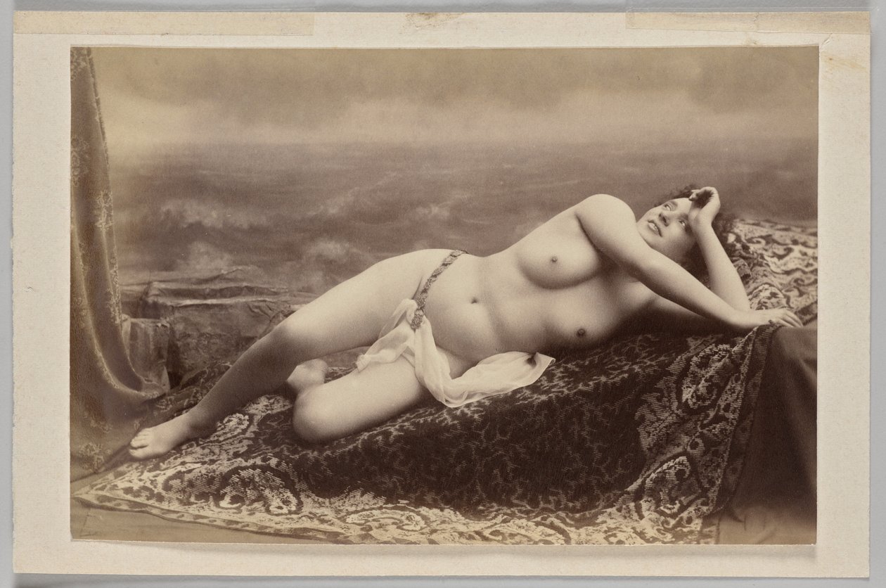 Untitled (Reclining Nude on Carpet Against Painted Backdrop of Waves) by Unknown artist