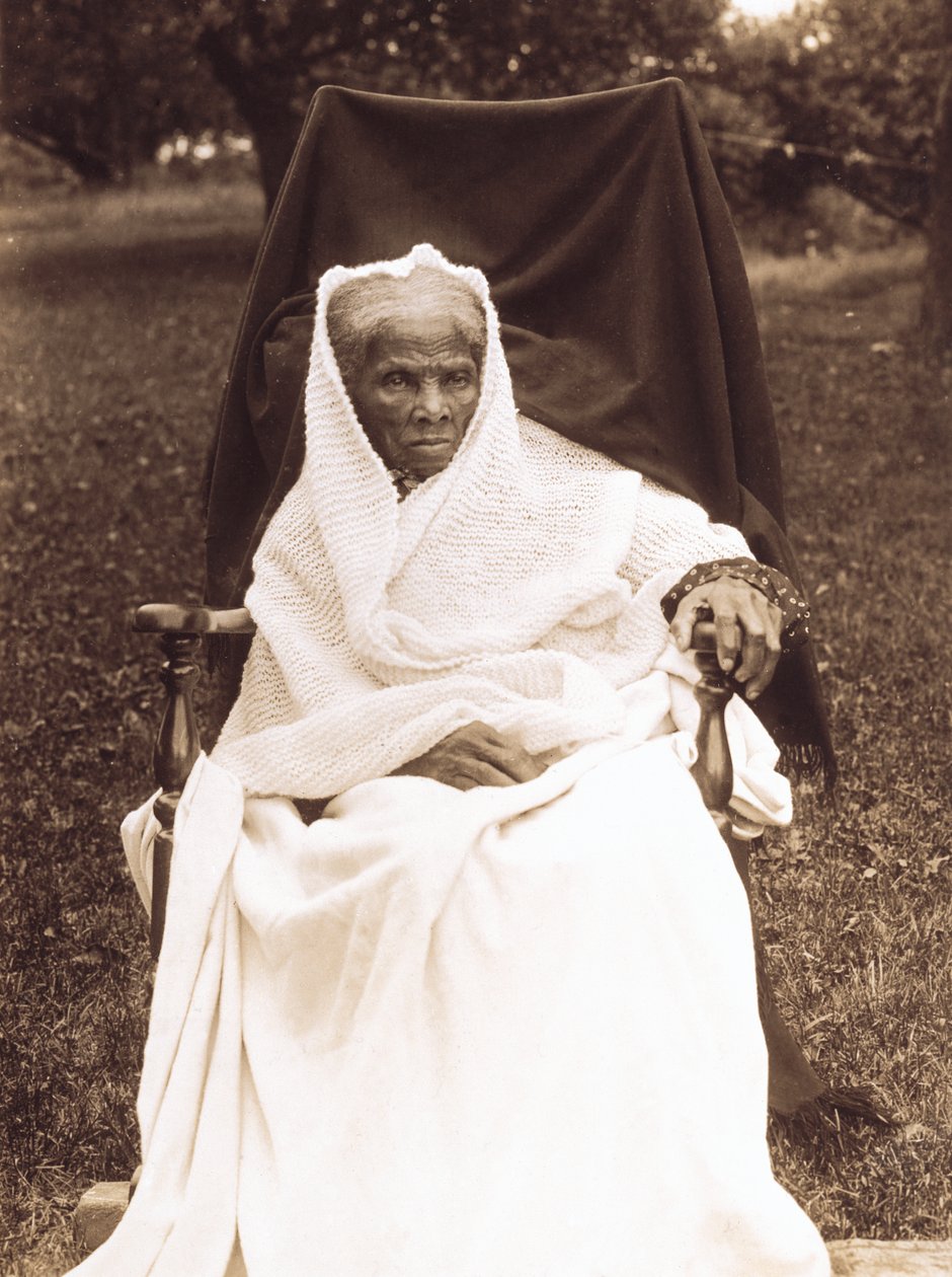 Harriet Tubman, full-length portrait, seated in chair, facing front, probably at her home in Auburn, New York by Unknown photographer