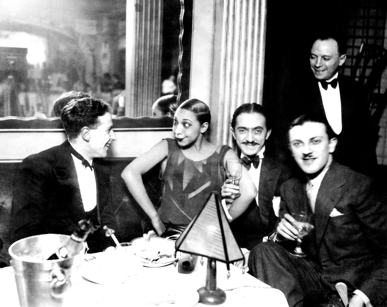 Josephine Baker with Georges Simenon and her fiance Guiseppe Abatino, Restaurant Chez Josephine, c.1928 by Unknown photographer