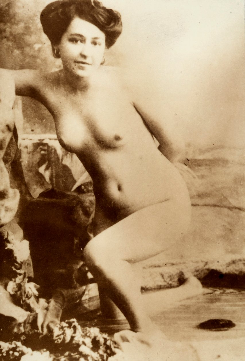 Nude portrait of a young woman getting out of a tub by Unknown photographer