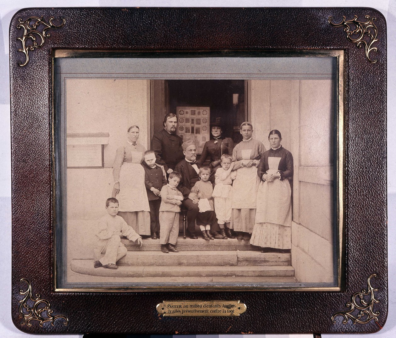 Pastor among English children treated preventively against rabies. Pastor Museum by Unknown photographer
