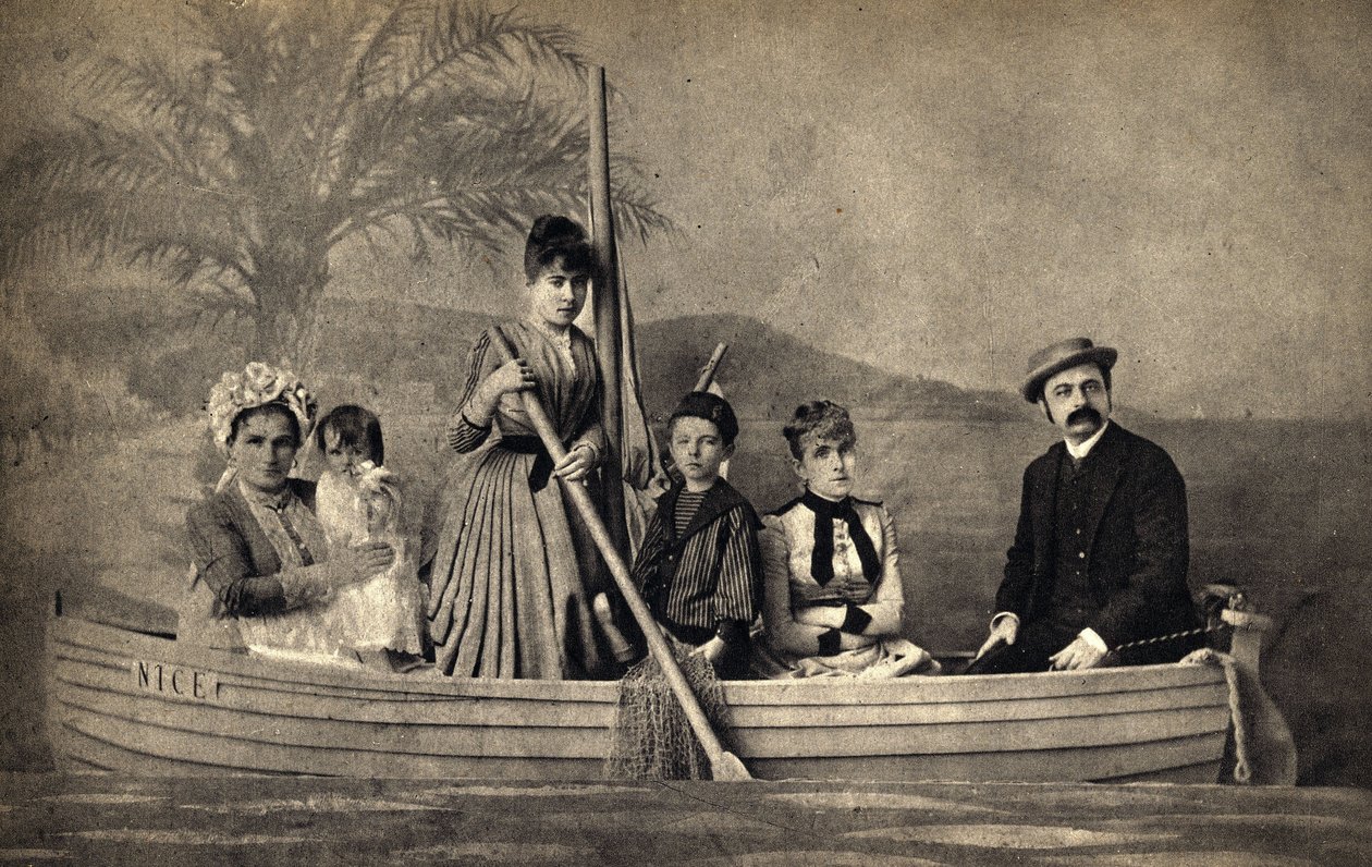 Portrait of a family with a photographer, staged in a boat. Photography, late 19th century, Paris. Coll. Selva by Unknown photographer