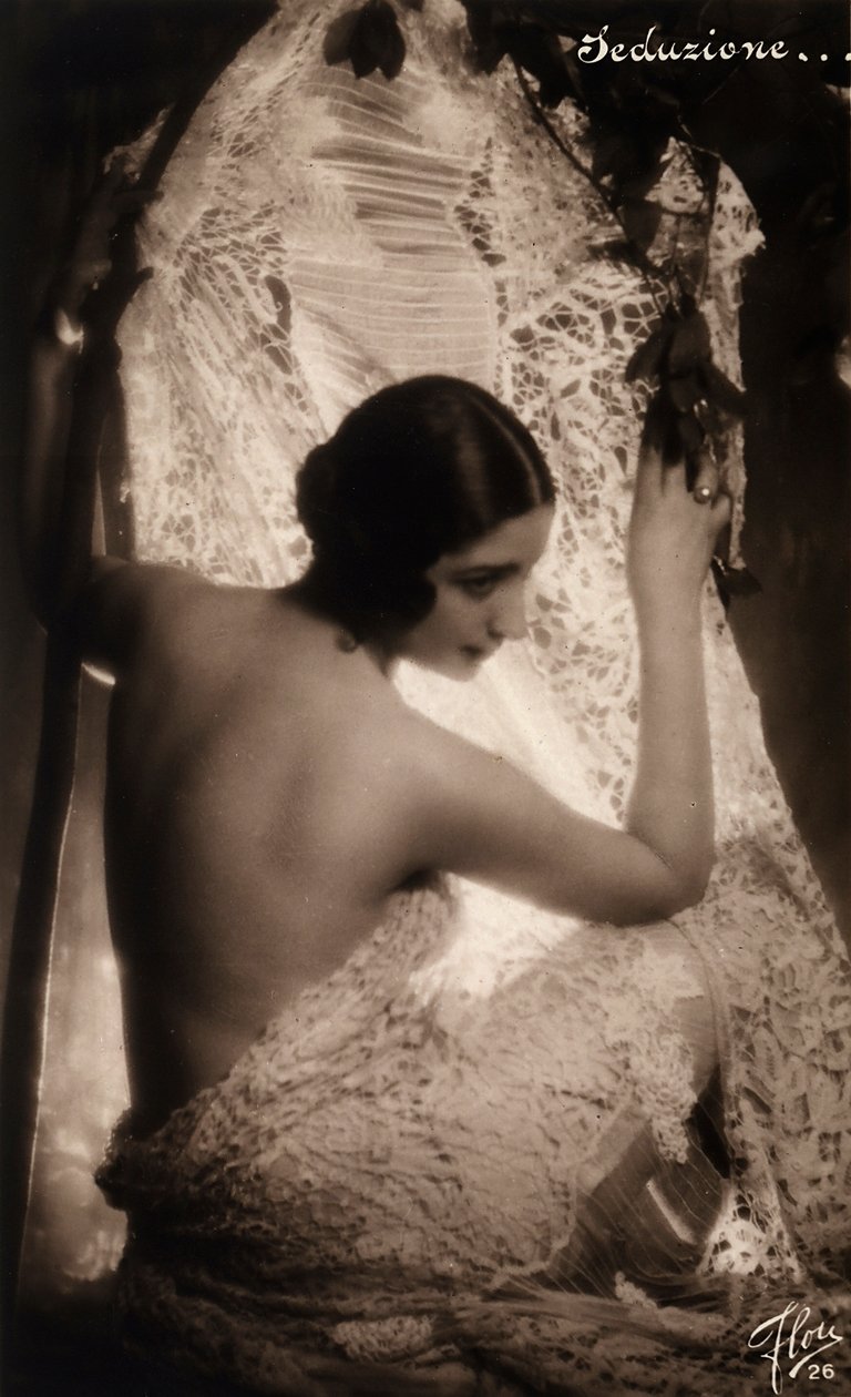 Portrait of a Young Woman Shrouded in a White Lace Cloth by Unknown photographer