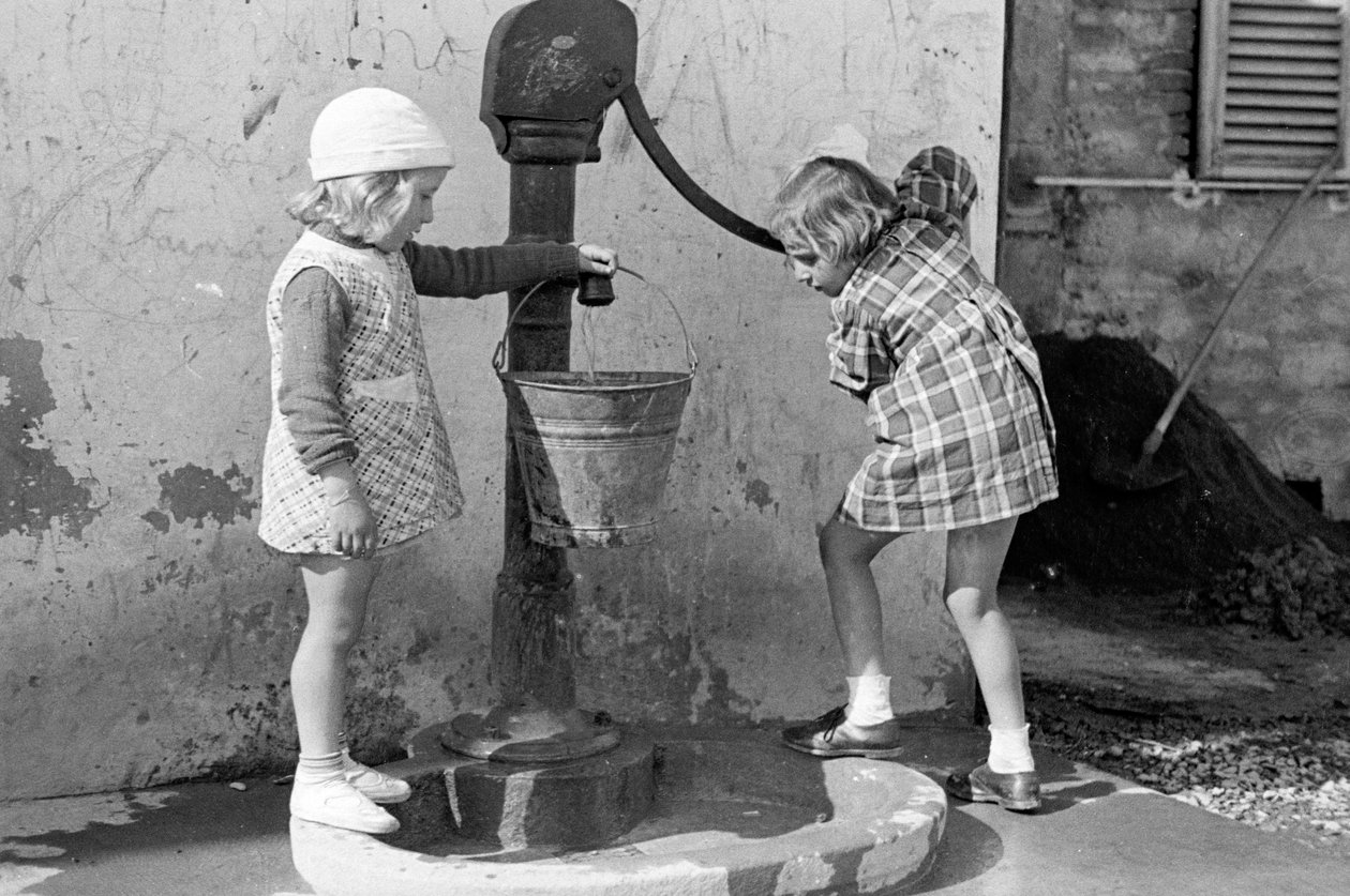 Little Girls Filling a Bucket of Water, 9th May 1939 by Vincenzo Balocchi