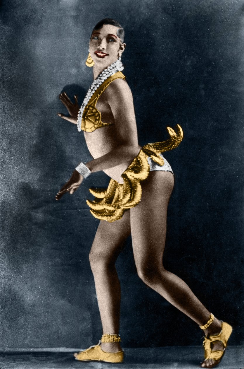 Josephine Baker (1906-1975) in 1925 in the Revue Negre at the Theatre des Champs-Elysees, with her banana belt. Photograph by Lucien Walery (1863-1935). by Walery