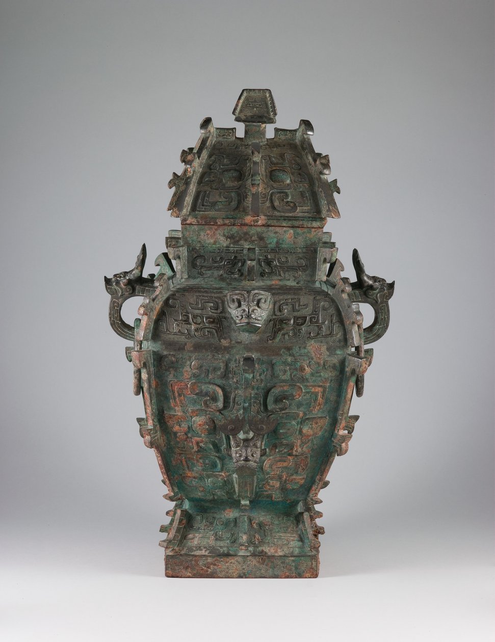 Covered wine vessel with zoomorphic masks and animal-headed handles by Western Zhou Dynasty Chinese School