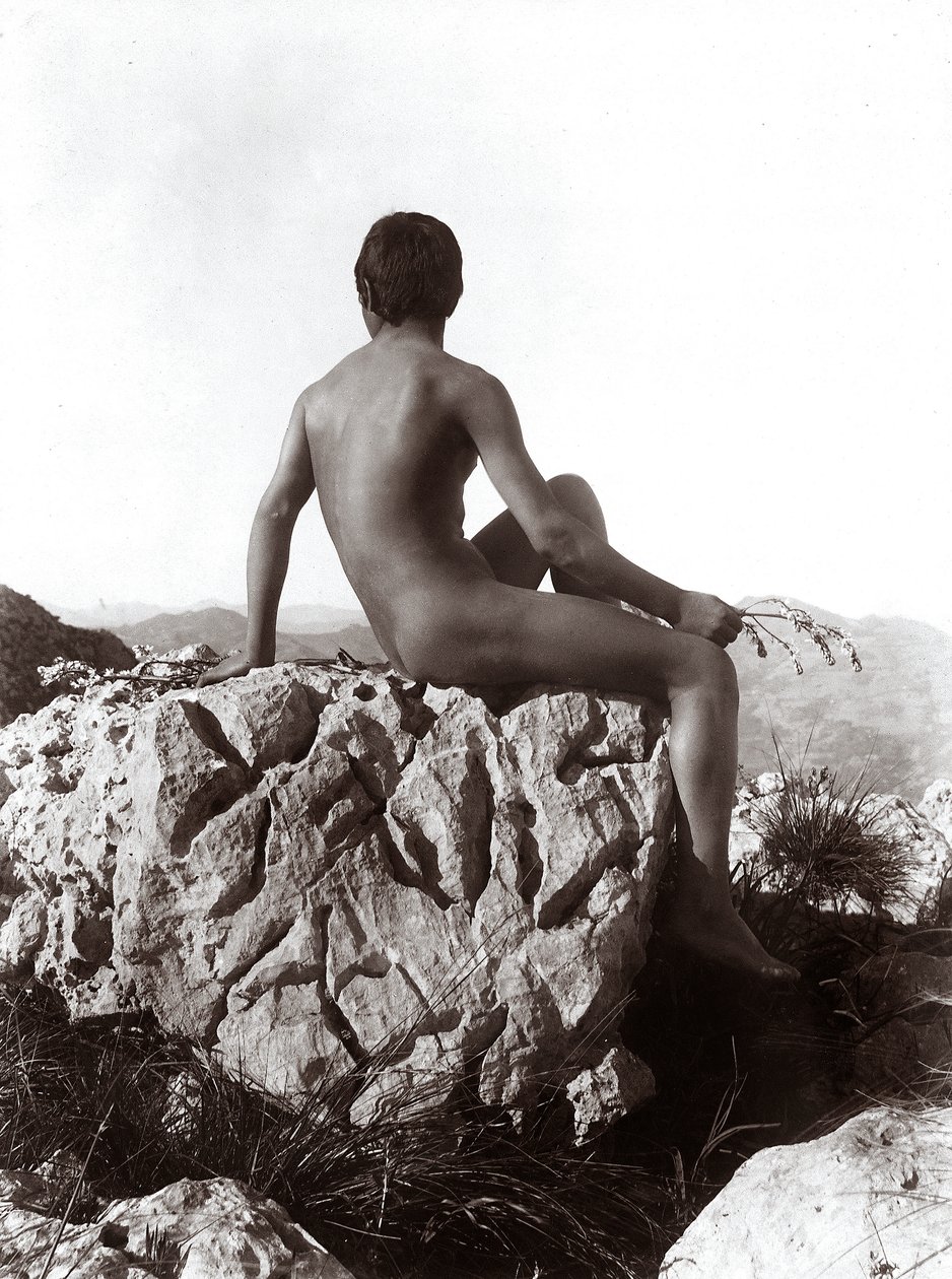 Young man posing on a rock by Wilhelm Baron von Gloeden