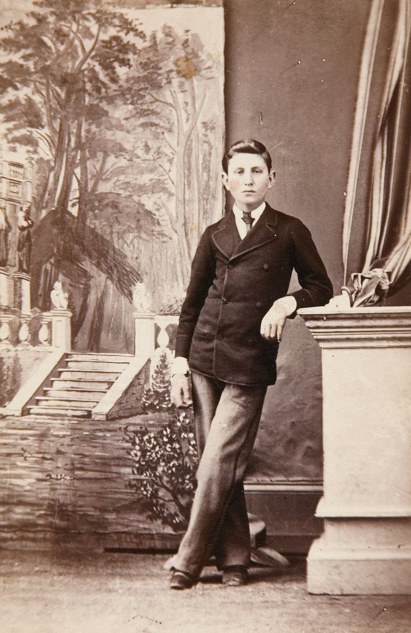 Studio Portrait of Young Man in Front of Painted Background of Stairs and Garden by William Bentley