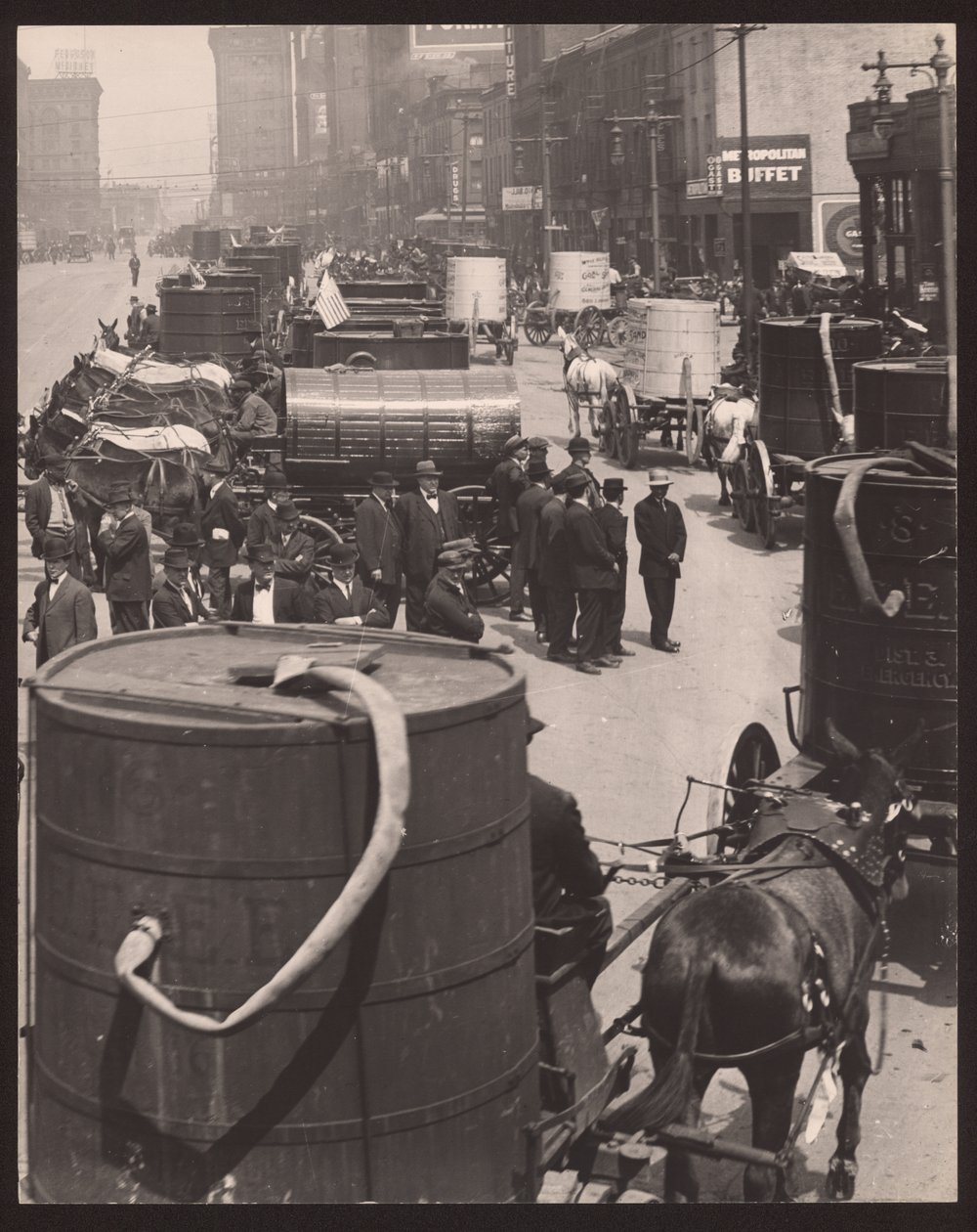 Horse-drawn Carts Pulling Water Casks with Men Standing in Front by William G. Swekosky
