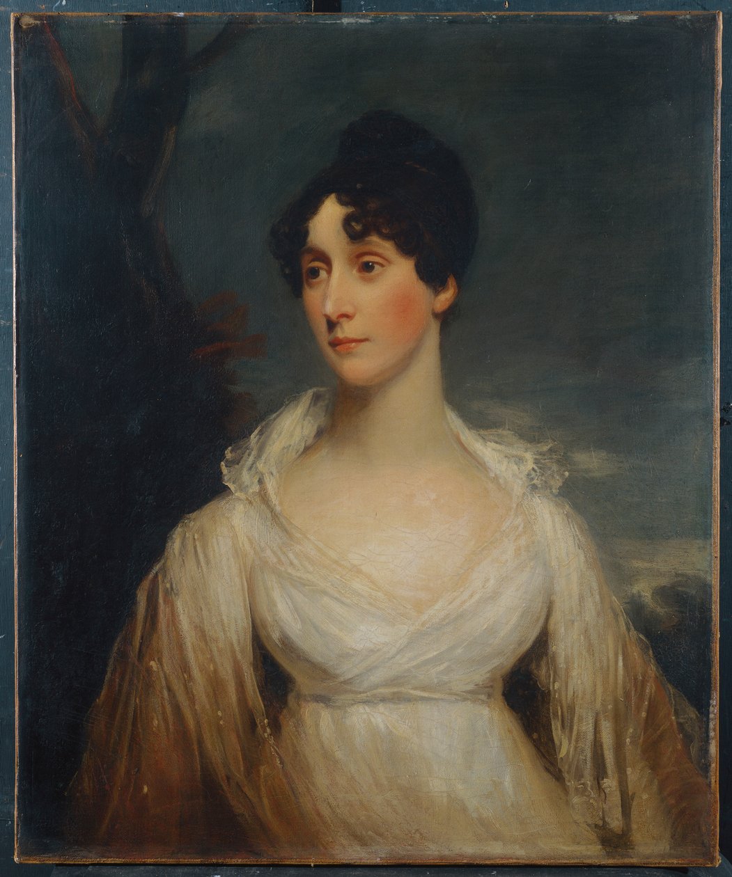Portrait of a lady seated, half length, wearing a white dress by William Beechey
