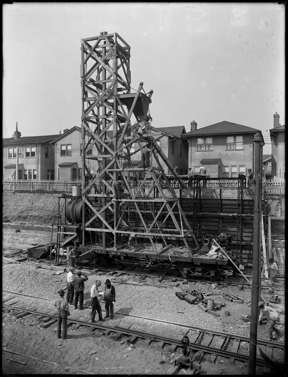 Erecting a concrete mixer at 1910 63rd Street, Brooklyn, c.1914 by William Davis Hassler