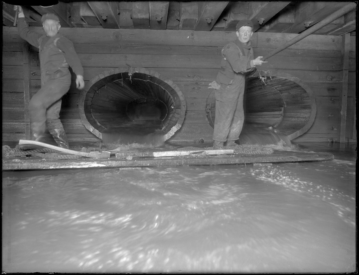 Men Working in the W. 129th Street Sewer, New York by William Davis Hassler