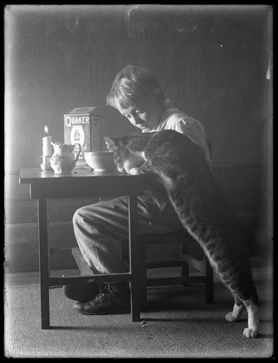 William Gray Hassler and Reddy the Cat, Eating Quaker Puffed Rice Cereal by William Davis Hassler