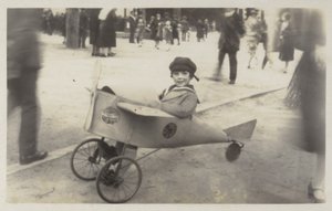 Boy in a Toy Aircraft by (after) English photographer