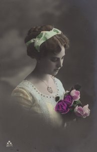 Girl peering into bunch of roses by (after) English photographer