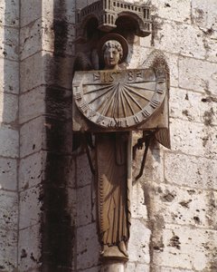 Gothic Art: Representation of the Angel on the Dial, Sculpture of the 20th century after an original of the 16th century preserved in the crypt, south-west corner of the Basilica Notre Dame de Chartres