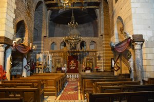 Interior of Saint Mercurius Church Abu Sefein in Old Cairo, historic Coptic Orthodox church with icons and wooden iconostasis