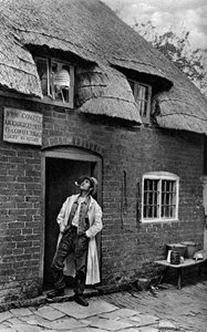 A Man Smoking a Pipe Outside a Shop, Worcestershire by A. W. Cutler