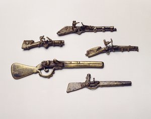Gold weights cast in the form of guns