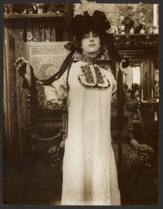 Female Model in a Long White Robe and a Hat with Ribbons, Paris by Alphonse Maria Mucha