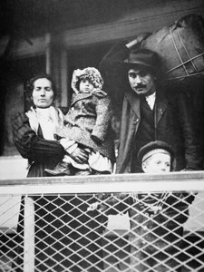 A migrant Italian family on the ferry from Ellis Island to New York City by American Photographer