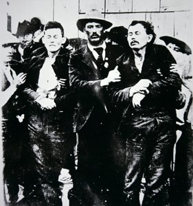 Bob and Grat Dalton with law officers by American Photographer