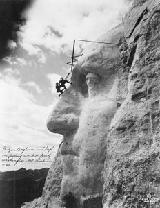 Gutzon Borglum inspecting work on Washington at Mount Rushmore, 1932 by American Photographer