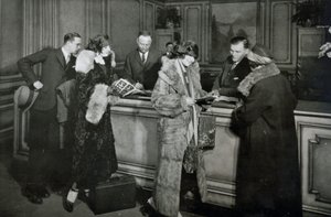 Passengers purchasing tickets at the ticket office of the Great Northern Railway, Chicago by American Photographer