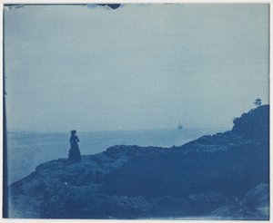 Woman Watching Schooner from a Rocky Promontory by American Photographer
