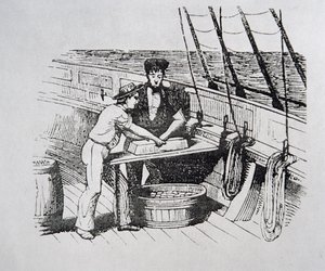 American whalers cutting whale blubber into 