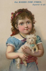 Girl Holding Small Dog in Her Arms