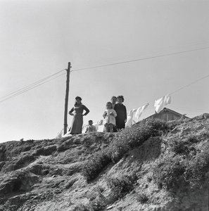 Women and Children Spreading Laundry by Ando Gilardi