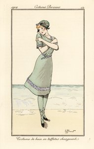 Woman on beach in swimming costume in two-tone taffeta by Andre Pecoud