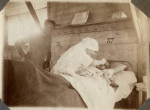 First World War 1914-1918: nurse shaving a soldier in Couville, Lower Normandy, France. Anonymous photograph July 1917. Private collection, Stella. by Anonymous Anonymous