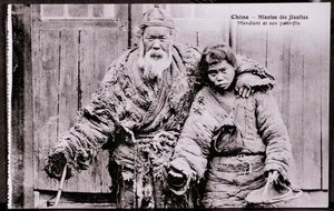Old beggar with grandson - Early 20th century photograph - Private collection