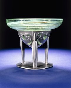 A Liberty Tudric pewter bowl with James Couper & Sons Clutha glass lining, c.1902-05 by Archibald Knox