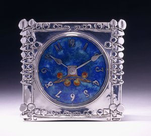 A square clock with a celtic motif in the Arts & Crafts style