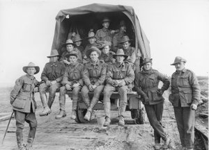 A lorry load of Australian Artillery reinforcements proceeding along the road to join the batteries of the 5th Australian Divisional Artillery, engaged in the battle for the Hindenburg Line Defences