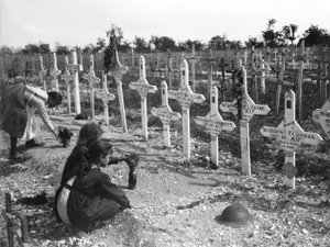 French children tending graves at Adelaide Cemetery of Australians killed in battle on the Western Front, Villers-Bretonneux, France 26 August 1919 by Australian Photographer