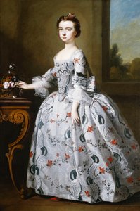 Portrait of a Girl, Full-Length, in a Grey Satin Dress with Elaborate Floral Embroidery, Beside a Basket of Flowers on a Table, a Wooded Landscape Beyond