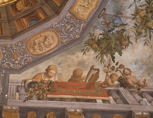 Checkers, musician, and cupids on balcony (detail), Treasury room, Ludovico il Moro Palace, Ferrara, Italy by Benvenuto Tisi da Garofalo