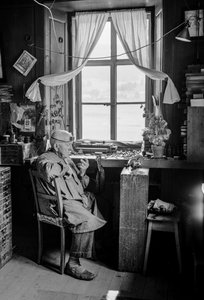 Italian watchmaker with his tools and workbench by Bernard F. Rogers