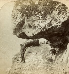 Man on a Cliff Overlooking Naeroyfjord, Sogne, Norway by Bert Underwood