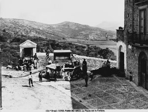 Piana dei Greci. The square with the fountain. by Brogi Brogi