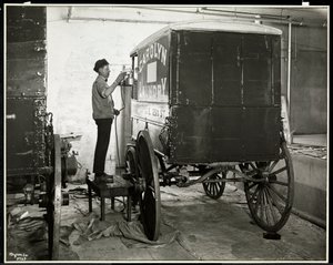 A Man Spraypainting a Delivery Wagon of the Carolyn Laundry at 111 East 128th Street, East Harlem, New York, 1929